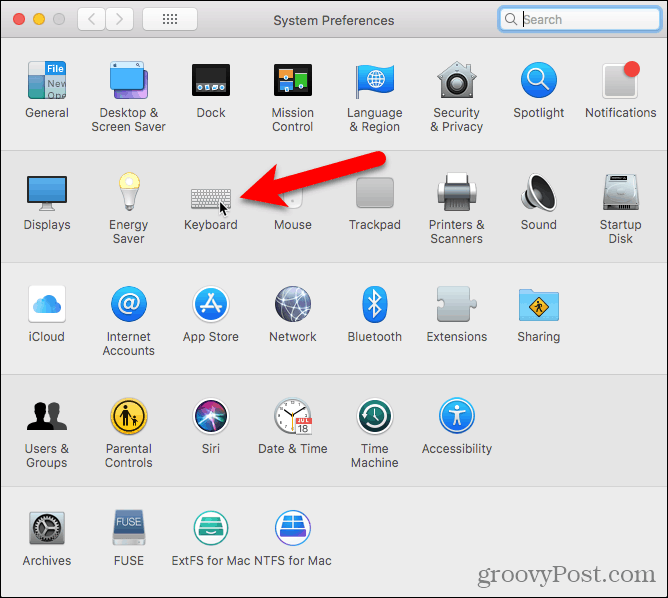 Napsauta Mac OS: n Järjestelmäasetusten Näppäimistö -painiketta